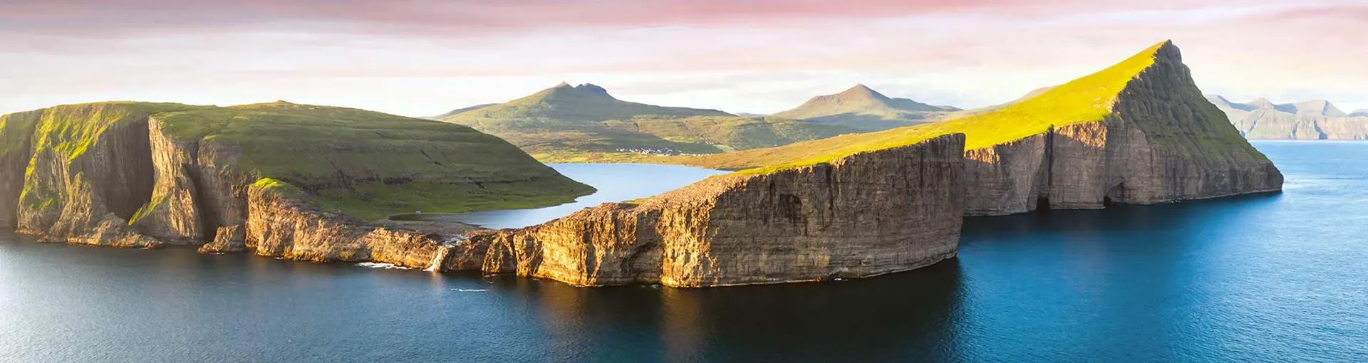 Faroe Islands dramatic landscapes - Nordic hidden gem with grass-roof houses, dramatic cliffs, and pristine wilderness